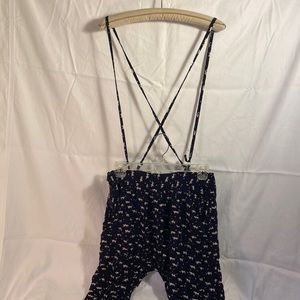 Super cute cat or dog print pants with overall type straps. Has pockets.